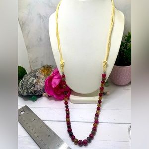 Beige leather like red and multicolored stone beaded costume long necklace 
Grea